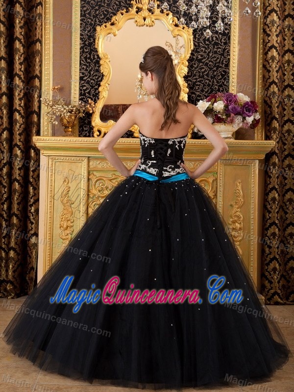 Strapless Black Sweet 16 Dress with Silver Embroidery and a Blue Sash
