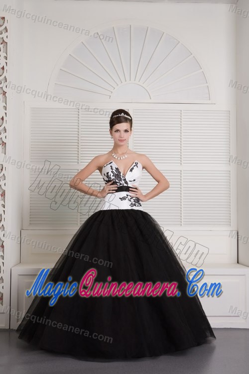 V-neck Black and White Quinceanera Dress with Embroidery and a Black Sash