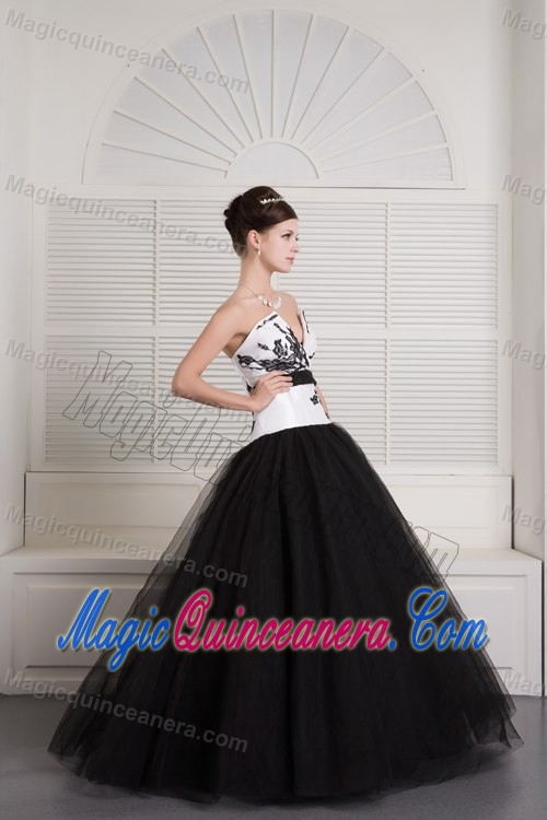 V-neck Black and White Quinceanera Dress with Embroidery and a Black Sash