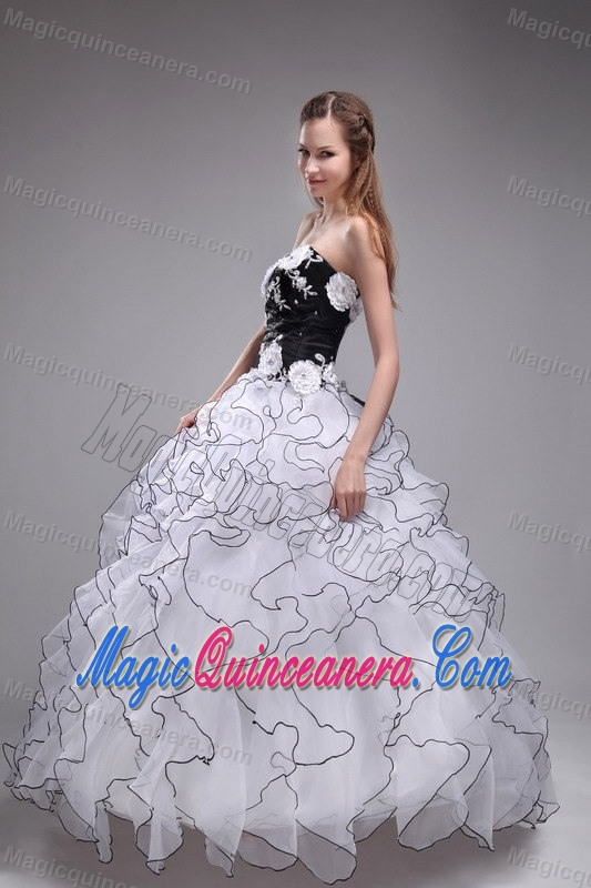 White and Black Quinceanera Dress with Ruffles and Hand Made Flowers