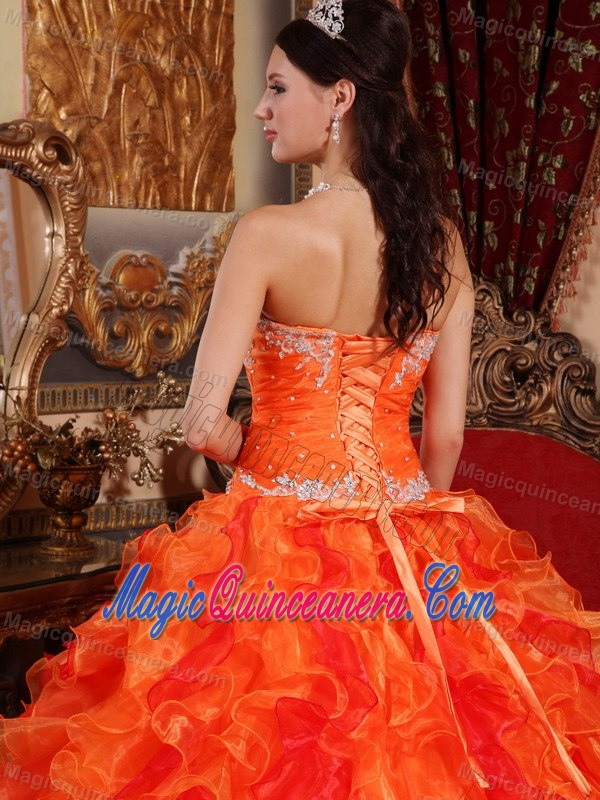 Orange Organza Quinceanera Dress with Appliques and Ruffled Skirt