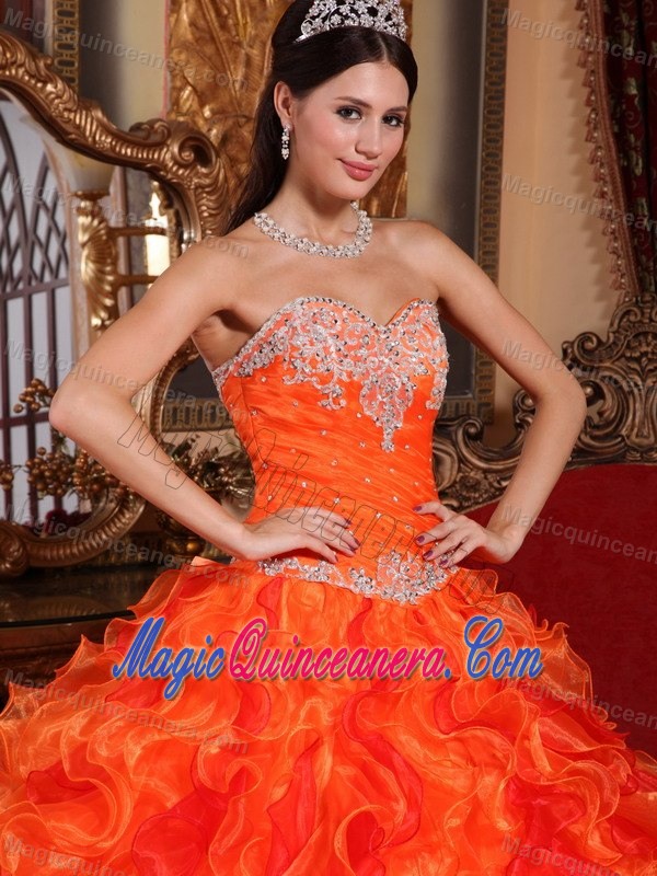 Orange Organza Quinceanera Dress with Appliques and Ruffled Skirt