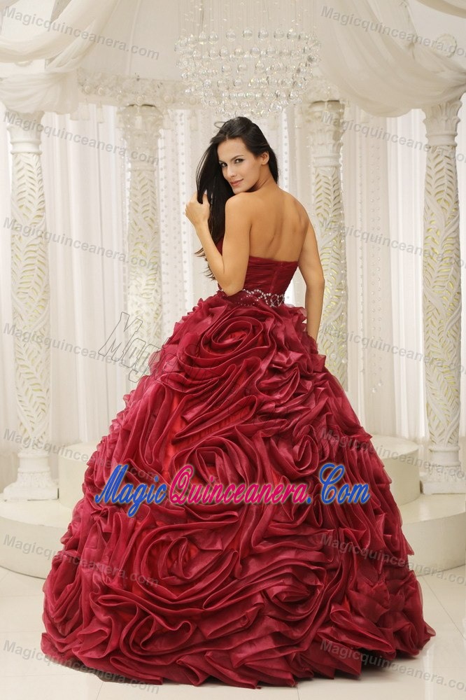 Beaded Wine Red Sweetheart Quinceanera Gown with Rolling Flowers