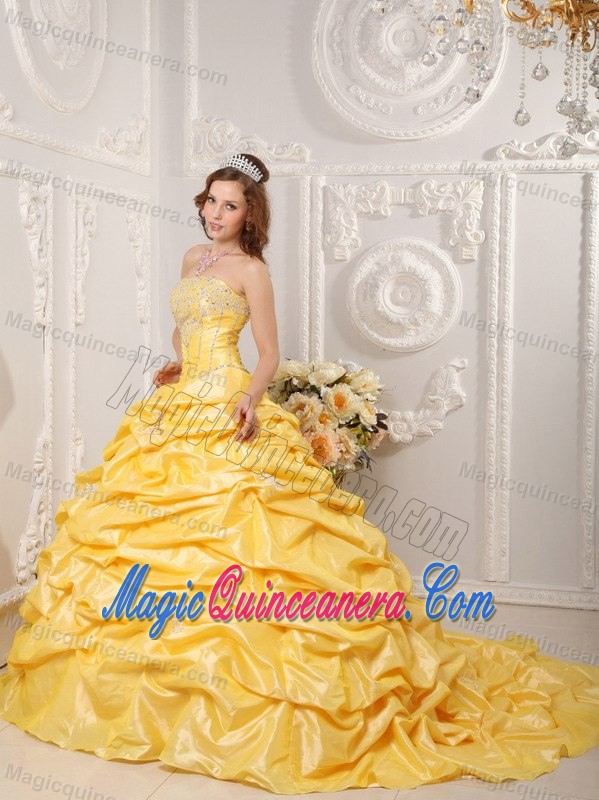 Gold Court Train Dresses for a Quince with Pick ups and Beading