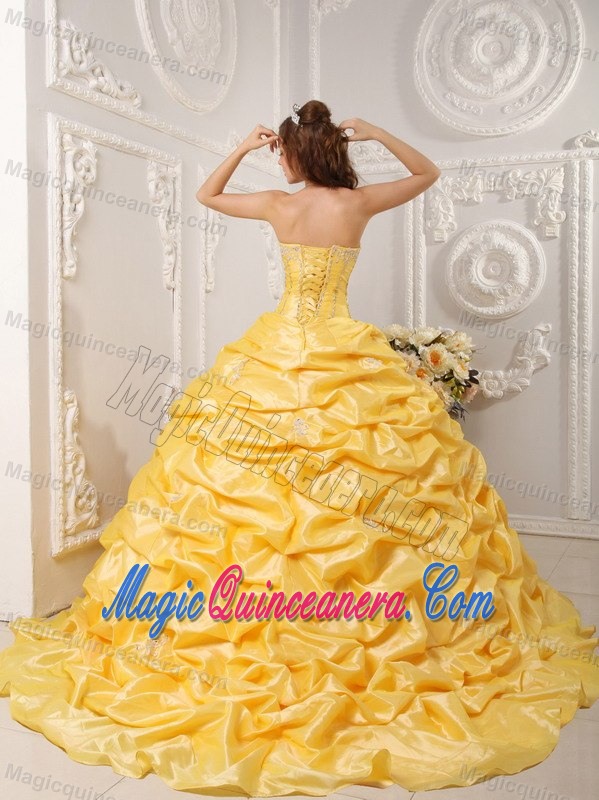 Gold Court Train Dresses for a Quince with Pick ups and Beading