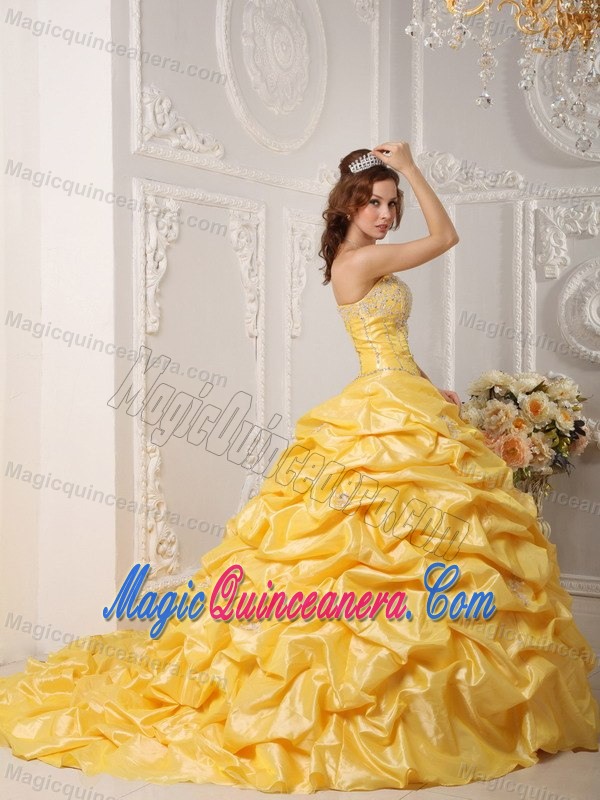 Gold Court Train Dresses for a Quince with Pick ups and Beading