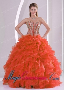 A Ball Gown Sweetheart With Ruffles and Beaded Decorate Coral Red Classic Quinceanera Gowns
