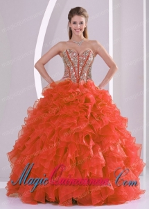 A Ball Gown Sweetheart With Ruffles and Beaded Decorate Coral Red Classic Quinceanera Gowns