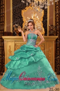 An Elegant Turquoise Ball Gown Strapless With Organza Beading Classic Quinceanera Gowns