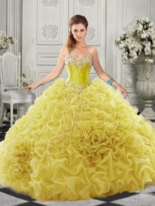 Fitting Yellow Sleeveless Beading and Ruffles Lace Up Quinceanera Gowns