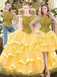 Most Popular Sleeveless Tulle Floor Length Zipper Quinceanera Gowns in Gold with Beading and Ruffled Layers
