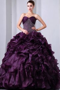 Dark Purple Sweetheart Beaded Dress for a Quinceanera Ruffled Layers