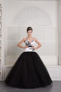 V-neck Black and White Quinceanera Dress with Embroidery and a Black Sash