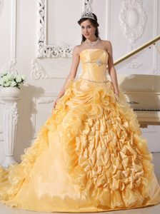 Strapless Gold Quinceanera Dress with Ruffles and a Chapel Train