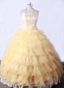 Gold Halter Little Girl Pageant Dress With Ruffled Layers and Beading