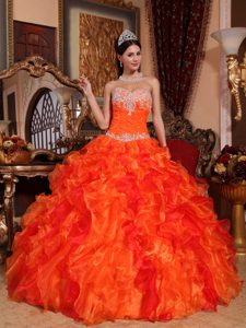 Orange Organza Quinceanera Dress with Appliques and Ruffled Skirt