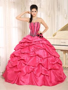 Beaded Flowers Pick Us Dresses for a Quinceanera in Hot Pink